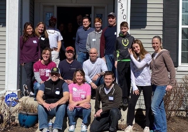 IMPACT Northbrook and SSDB Team on porch of home