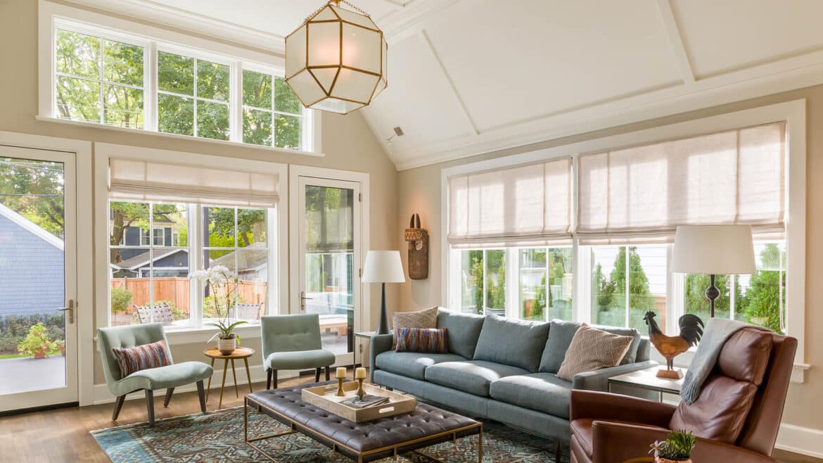 Evanston Modern farmhouse living room with barrel-vaulted ceilings, wall of windows and doors to back deck