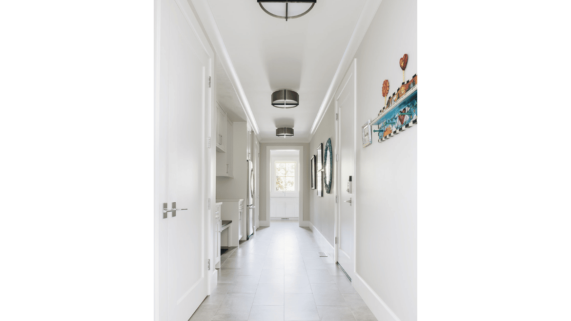 Modern mountain craftsman home white hallway with black round ceiling lights