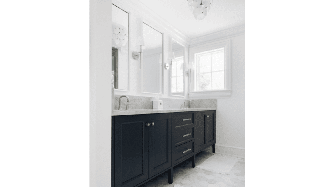 Black cabinet double vanity sinks with three mirrors and window, gray marble countertop and hexagonal floor tile