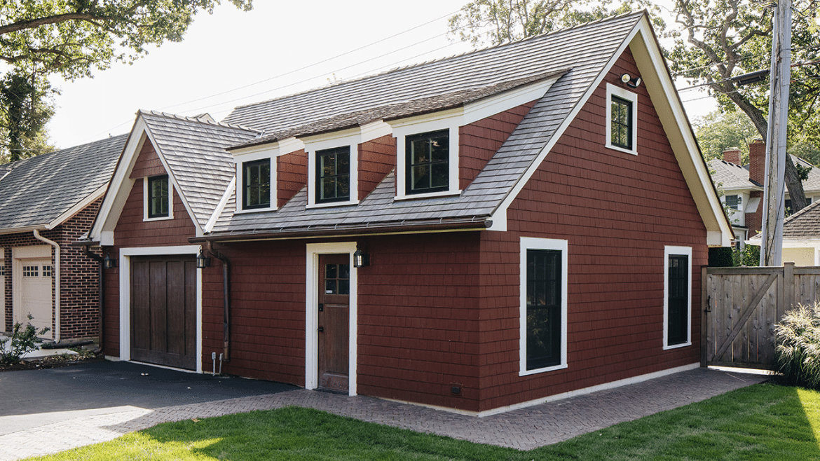 Free-standing garage with red siding, 3 gables and studio space